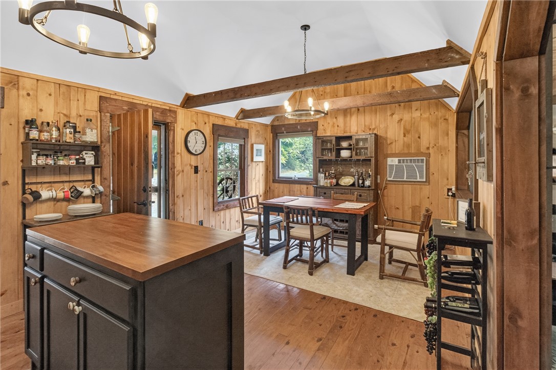 130 Maggie Rufus Lane Westminster, SC 29693 - Photo 11 of 50 Natural wood paneling and exposed beams create a cozy, rustic ambiance in this inviting dining space.