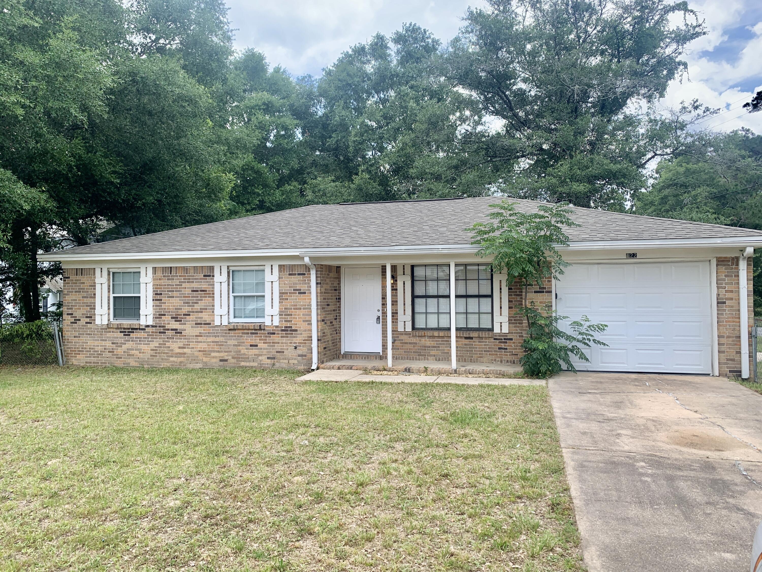 122 West 1st Avenue Crestview, FL 32536 - Photo 1 of 15 front view of a house with a yard