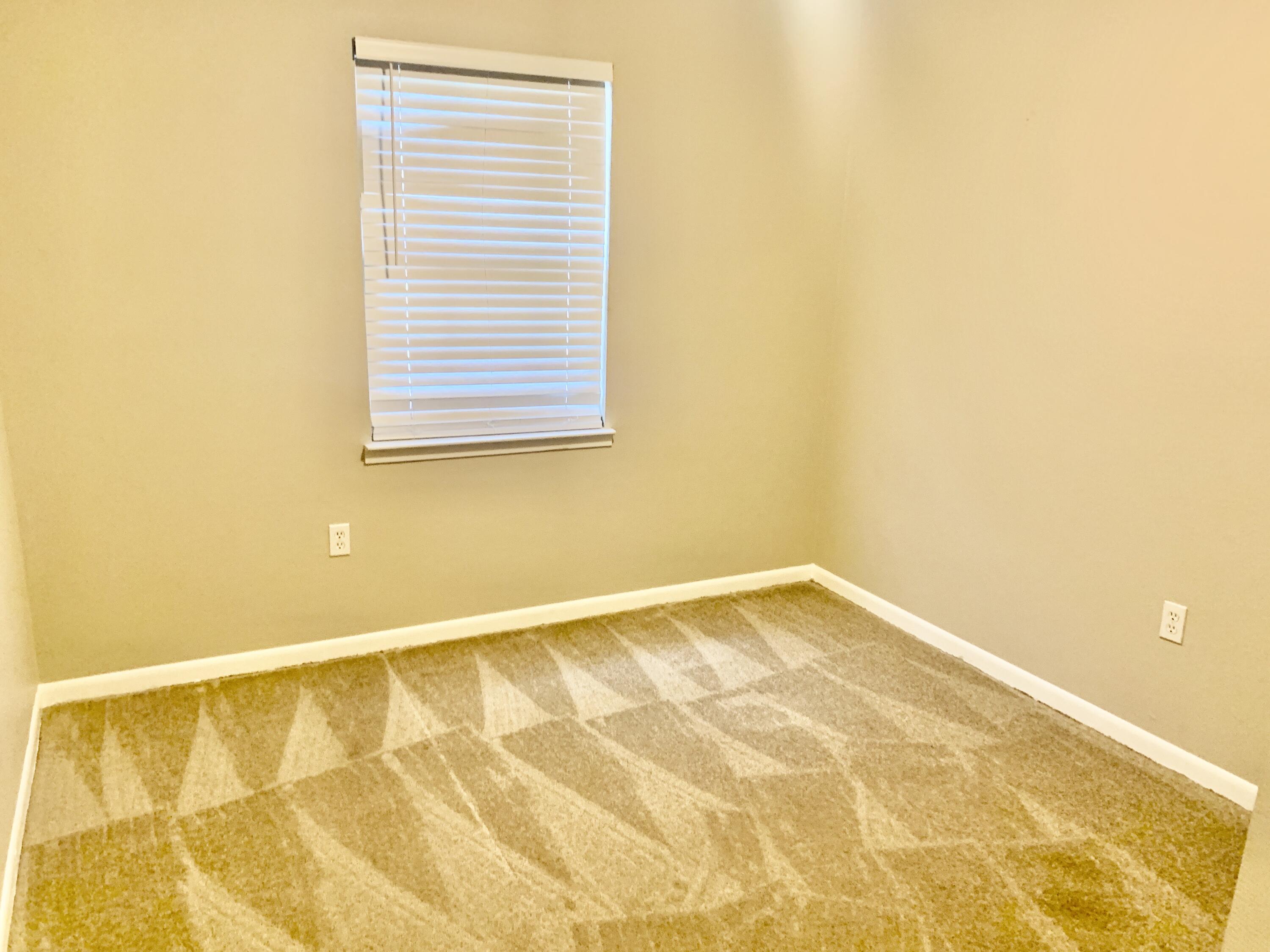 122 West 1st Avenue Crestview, FL 32536 - Photo 14 of 15 a view of an empty room with a window
