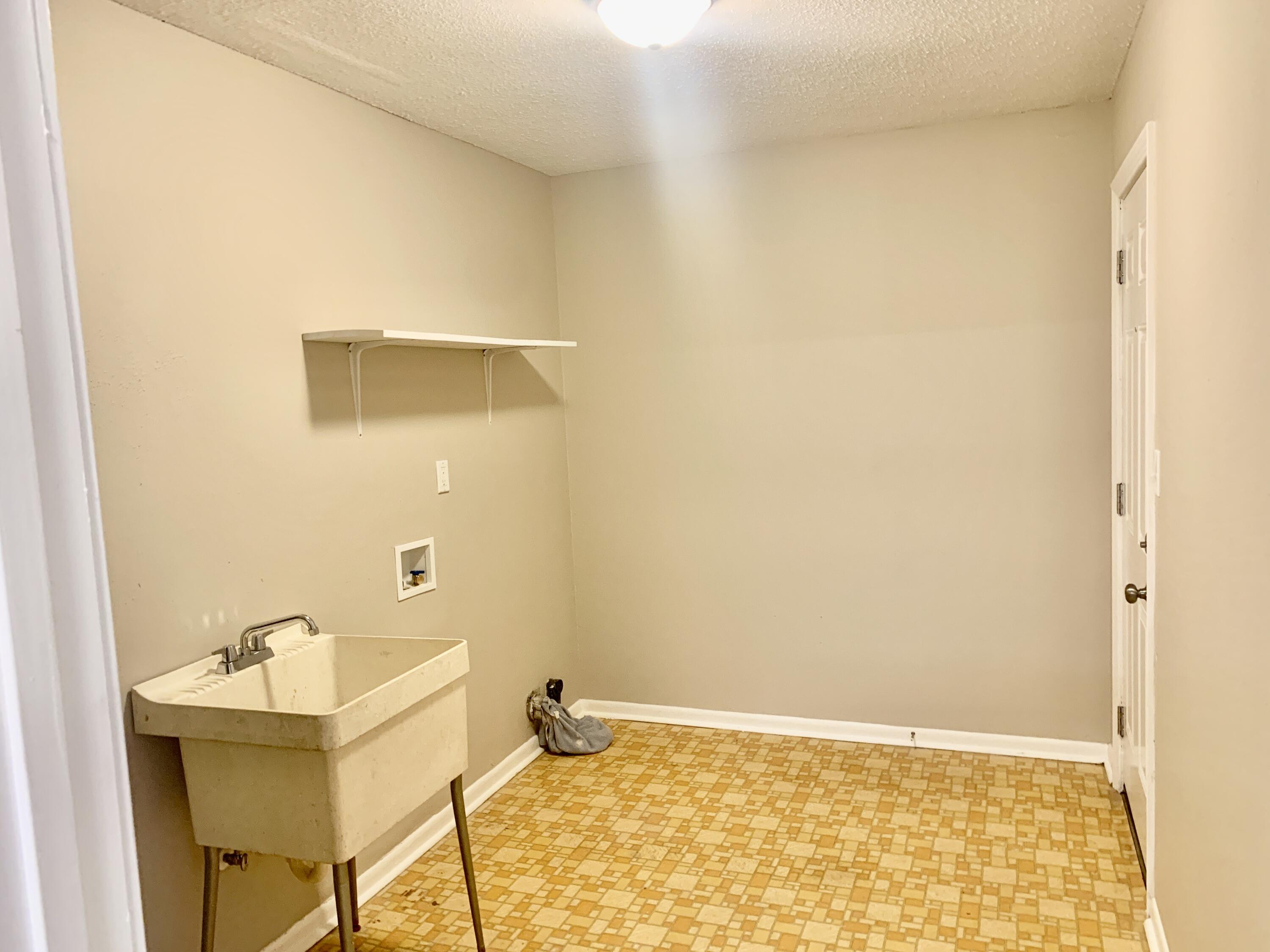 122 West 1st Avenue Crestview, FL 32536 - Photo 15 of 15 a bathroom with a sink and a mirror