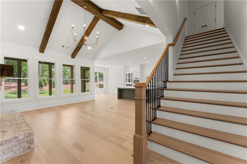285 Reese Way Ball Ground, GA 30107 - Photo 10 of 30 a view of entryway and hall with wooden floor