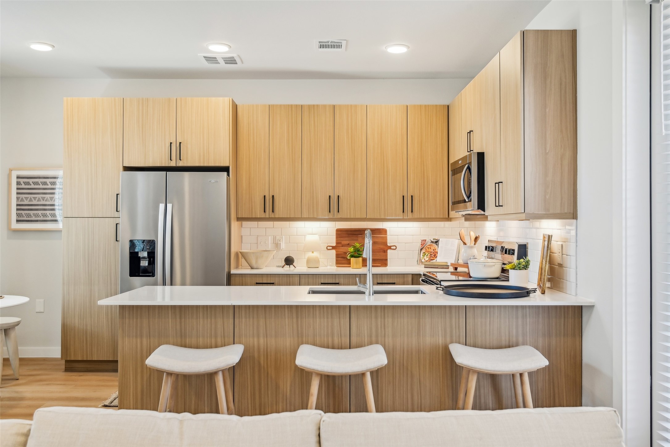 3651-411 South Custer Road McKinney, TX 75070 - Photo 16 of 28 a kitchen with stainless steel appliances granite countertop a sink and a white cabinets