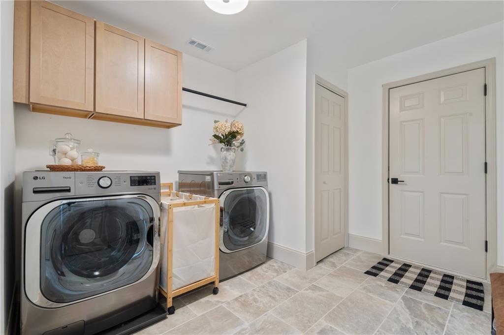 2625 Crosswynd Terrace Cumming, GA 30040 - Photo 13 of 20 a utility room with sink dryer and washer