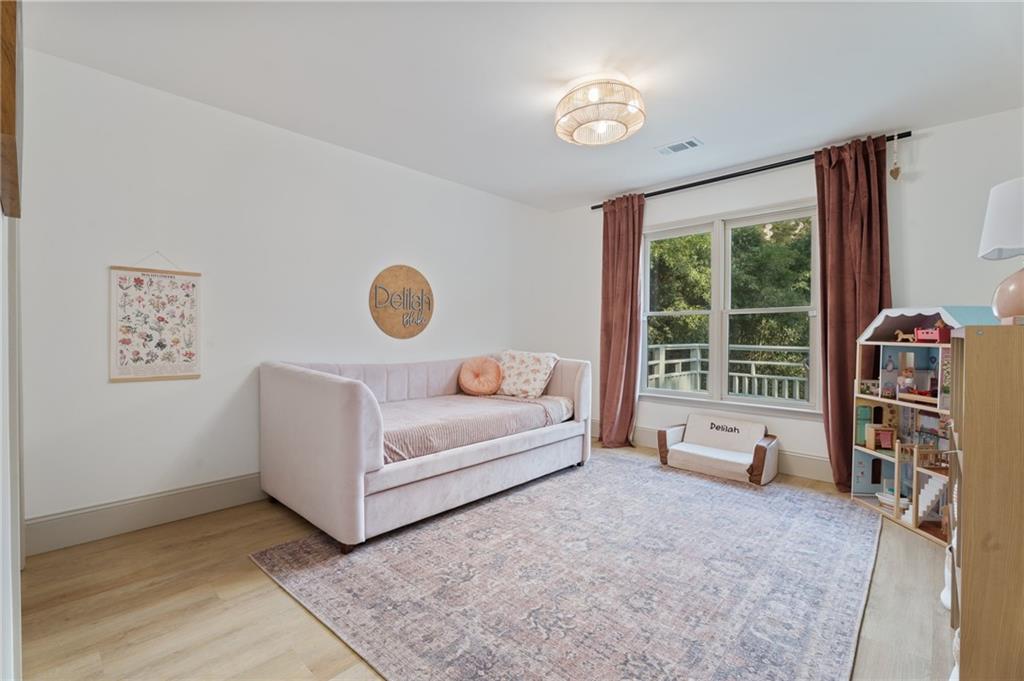 2625 Crosswynd Terrace Cumming, GA 30040 - Photo 16 of 20 a living room with furniture and a window