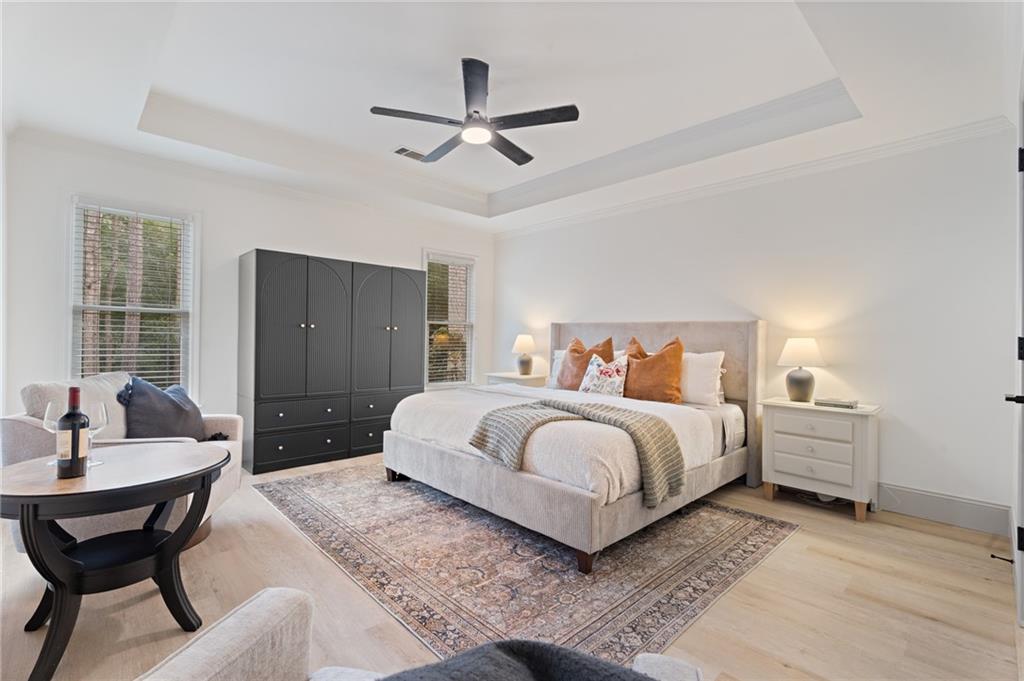 2625 Crosswynd Terrace Cumming, GA 30040 - Photo 10 of 20 a spacious bedroom with a bed and window