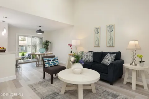 a living room with furniture and a table