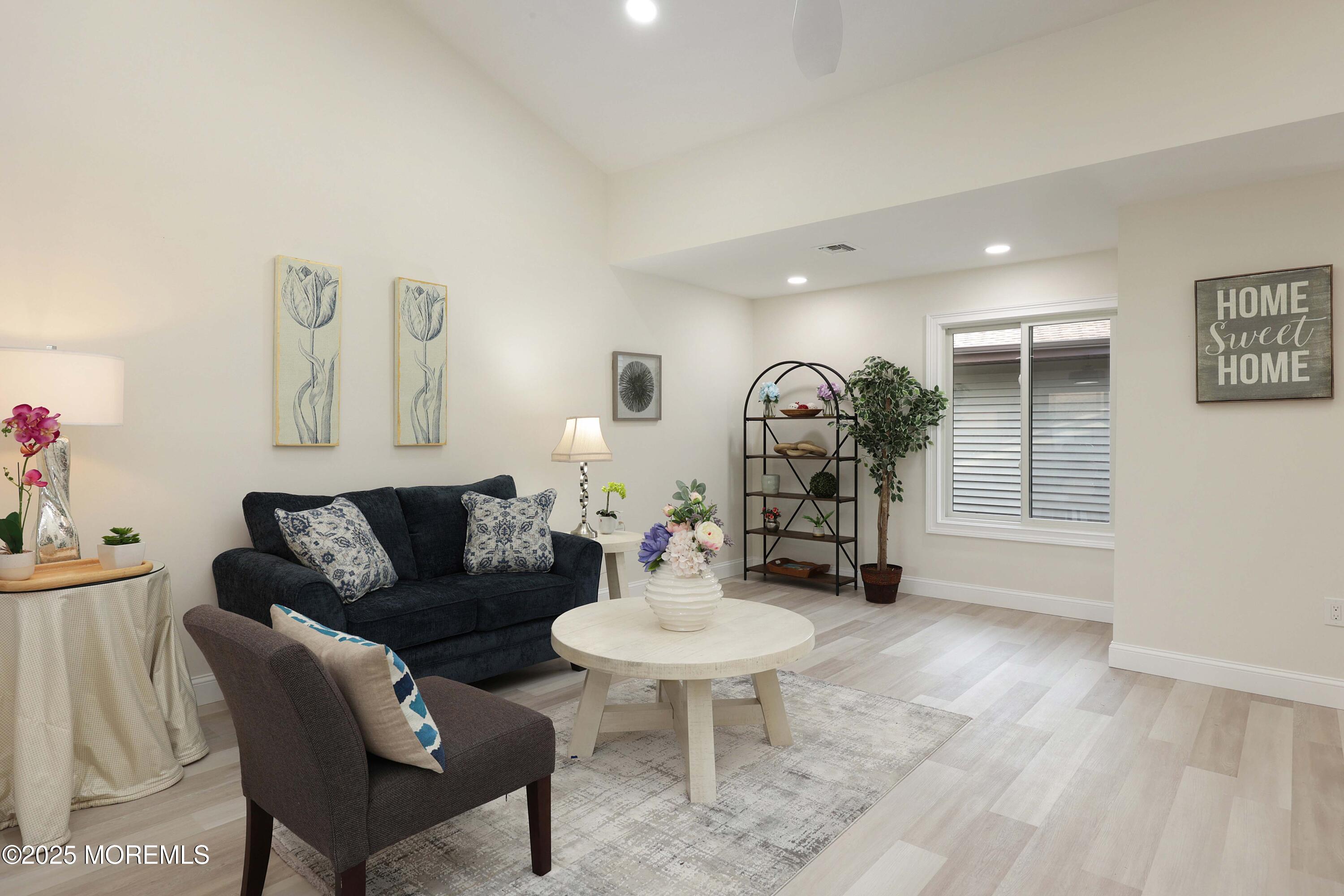 3 Auburn Court Red Bank, NJ 07701 - Photo 12 of 57 a living room with furniture and a wooden floor