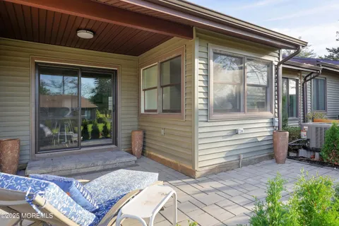 a front view of a house with a yard and porch