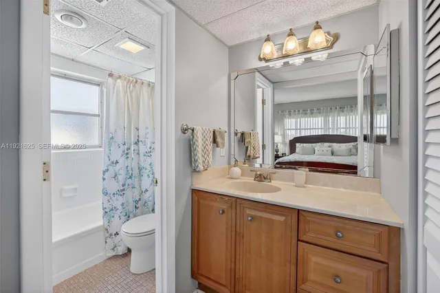 a bathroom with a toilet and shower