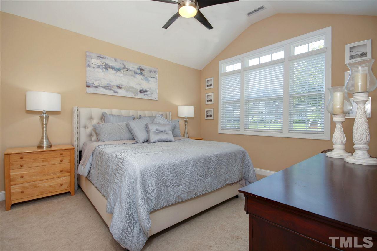 620 Democracy Street Raleigh, NC 27603 - Photo 11 of 24 1st floor bedroom features his and her closets and great natural light.