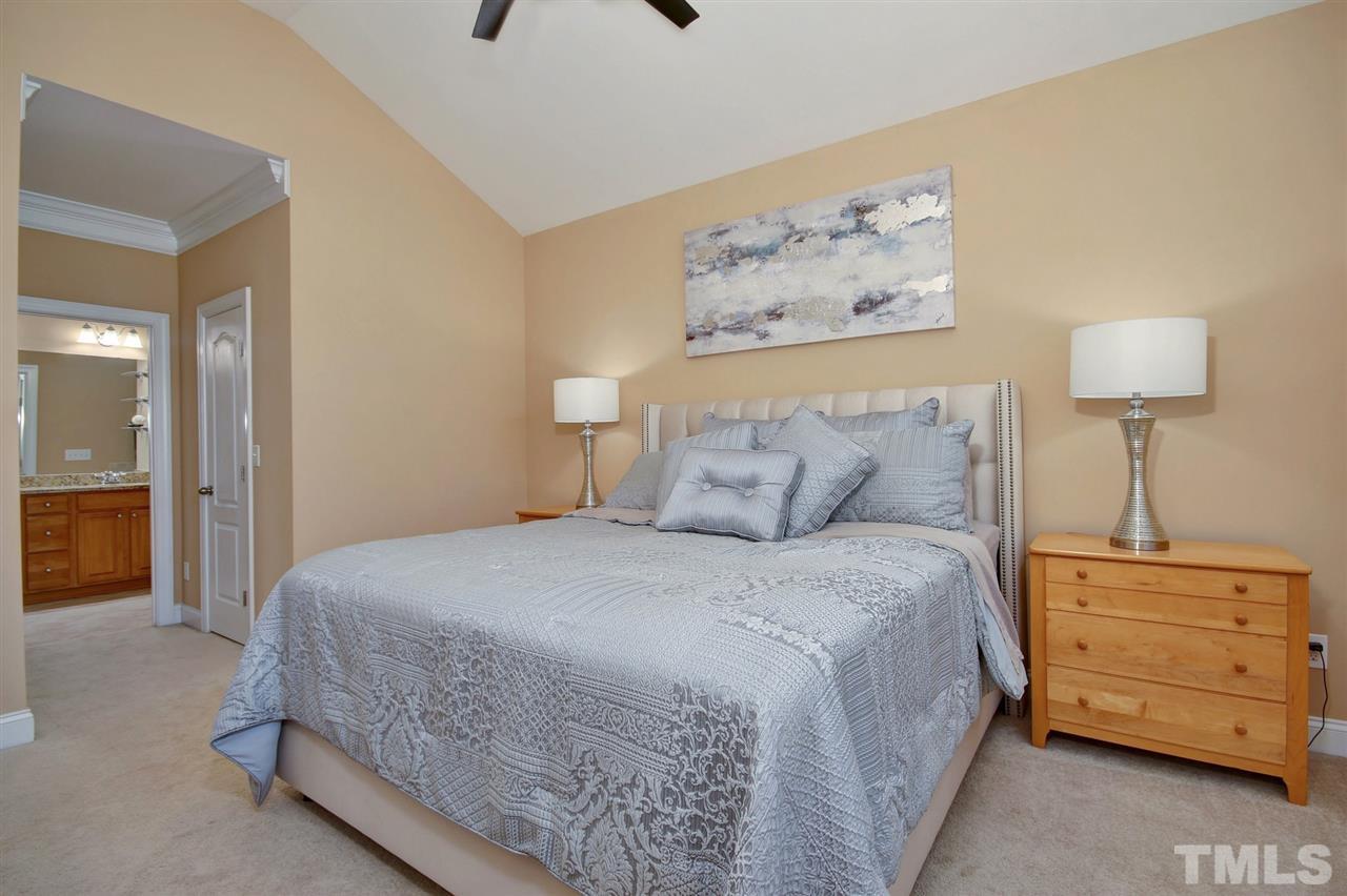 620 Democracy Street Raleigh, NC 27603 - Photo 12 of 24 High arched ceilings and a ceiling fan enhance the already big space.