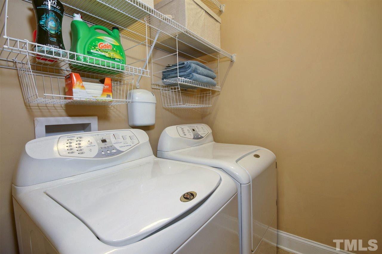 620 Democracy Street Raleigh, NC 27603 - Photo 16 of 24 Separate laundry room with shelving.