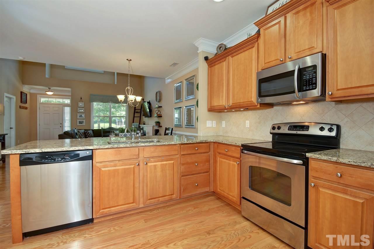620 Democracy Street Raleigh, NC 27603 - Photo 8 of 24 Large eat in kitchen with stainless steel appliances and plenty of counter space for food prep.