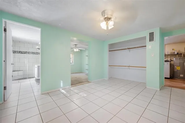 a view of a room with cabinet and mirrors