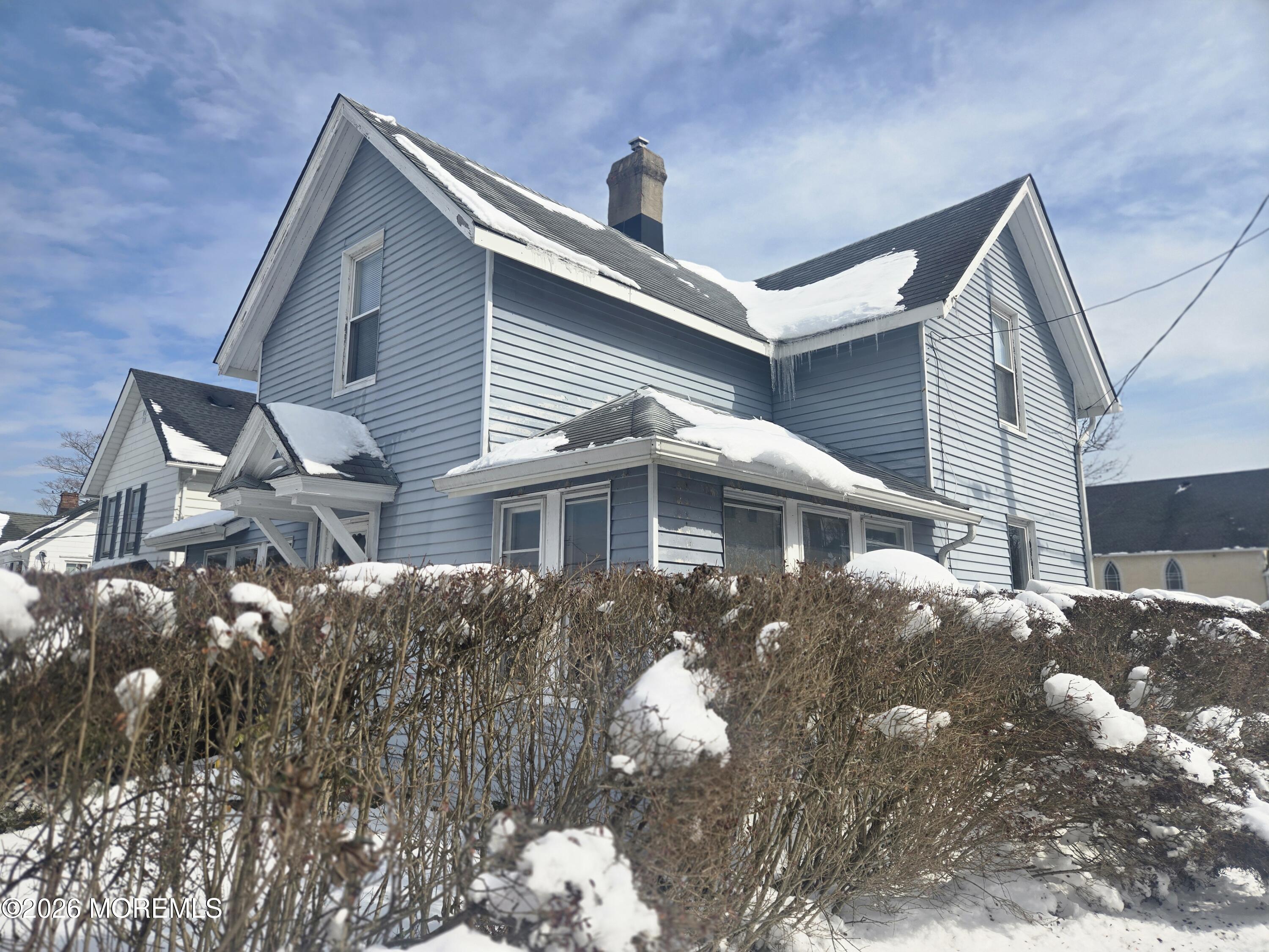 254 First Avenue Atlantic Highlands, NJ 07716 - Photo 1 of 18 a front view of a house with a yard
