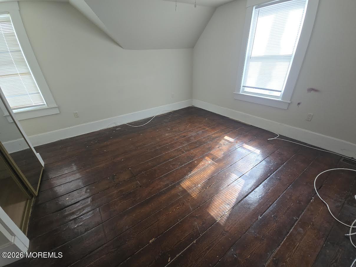 254 First Avenue Atlantic Highlands, NJ 07716 - Photo 13 of 18 a view of a livingroom with wooden floor and window