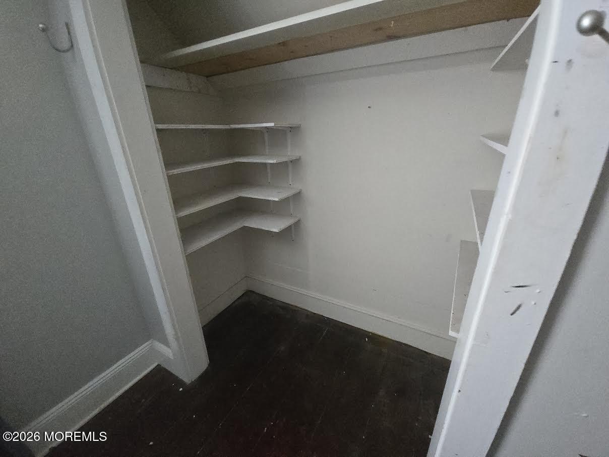 254 First Avenue Atlantic Highlands, NJ 07716 - Photo 14 of 18 a view of walk in closet with empty racks