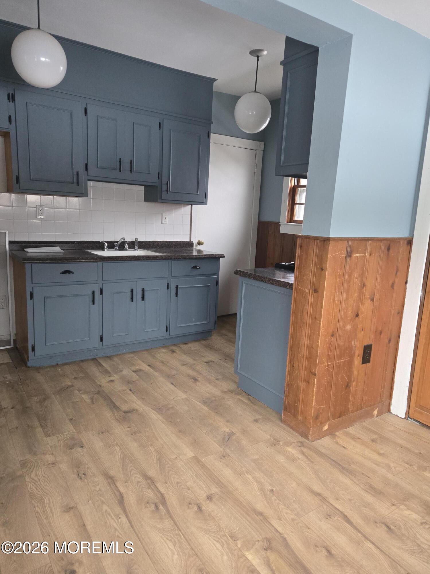 254 First Avenue Atlantic Highlands, NJ 07716 - Photo 7 of 18 a kitchen with granite countertop a refrigerator and a stove