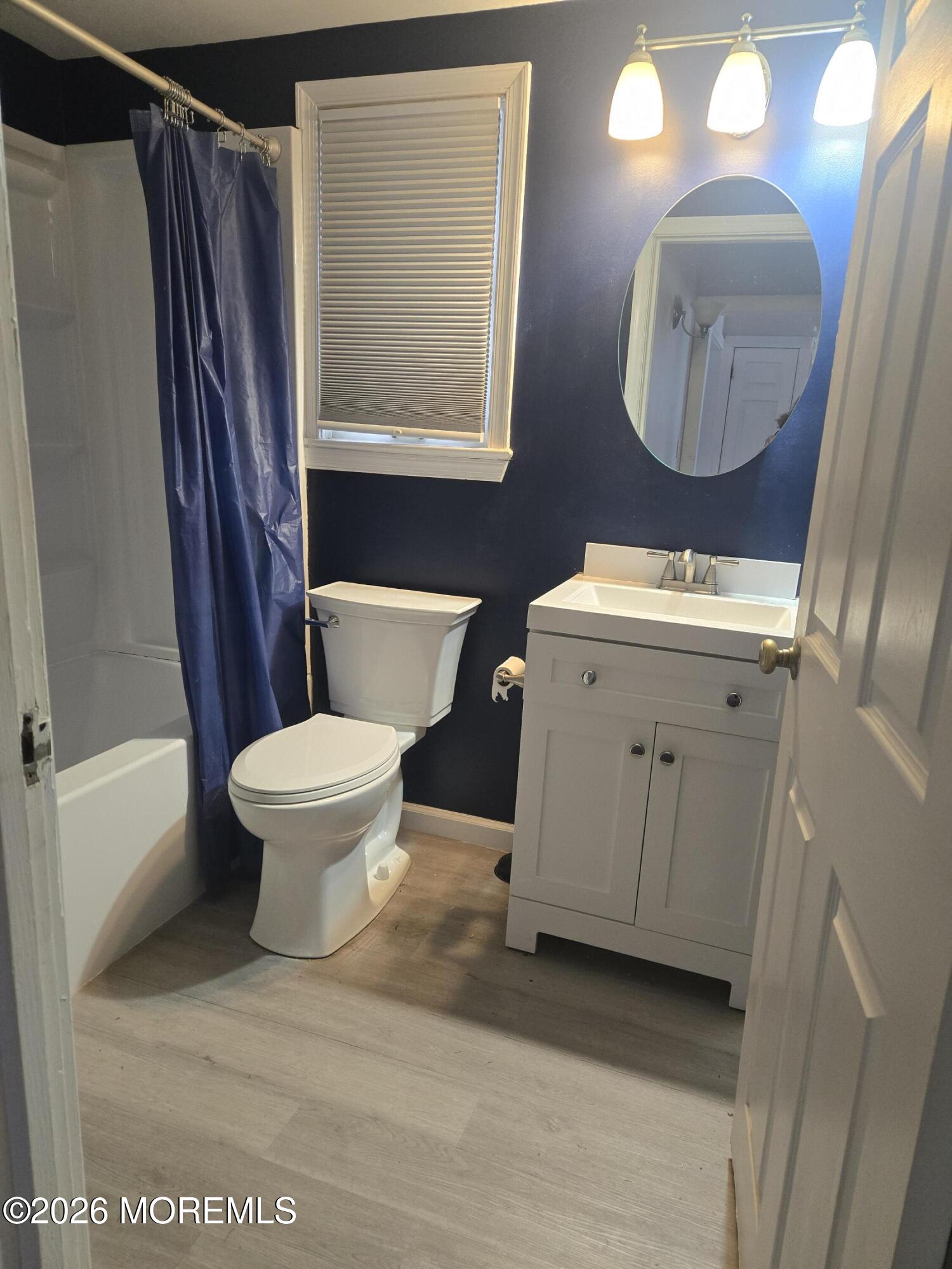 254 First Avenue Atlantic Highlands, NJ 07716 - Photo 9 of 18 a white toilet sitting next to a bathroom sink