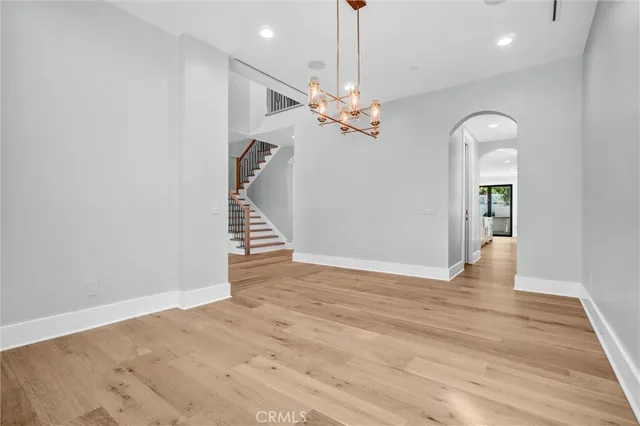 a kitchen with kitchen island a sink appliances and a window