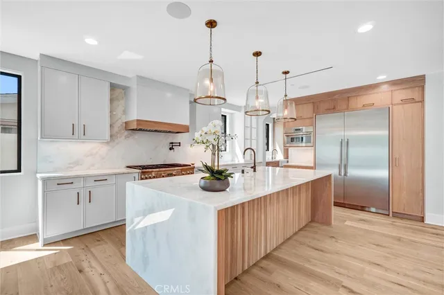 a view of wooden floor and windows in a room