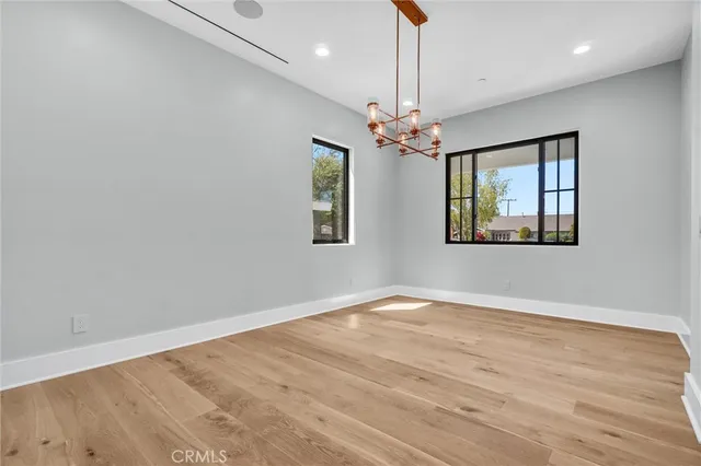 a kitchen with stainless steel appliances granite countertop a sink and a refrigerator