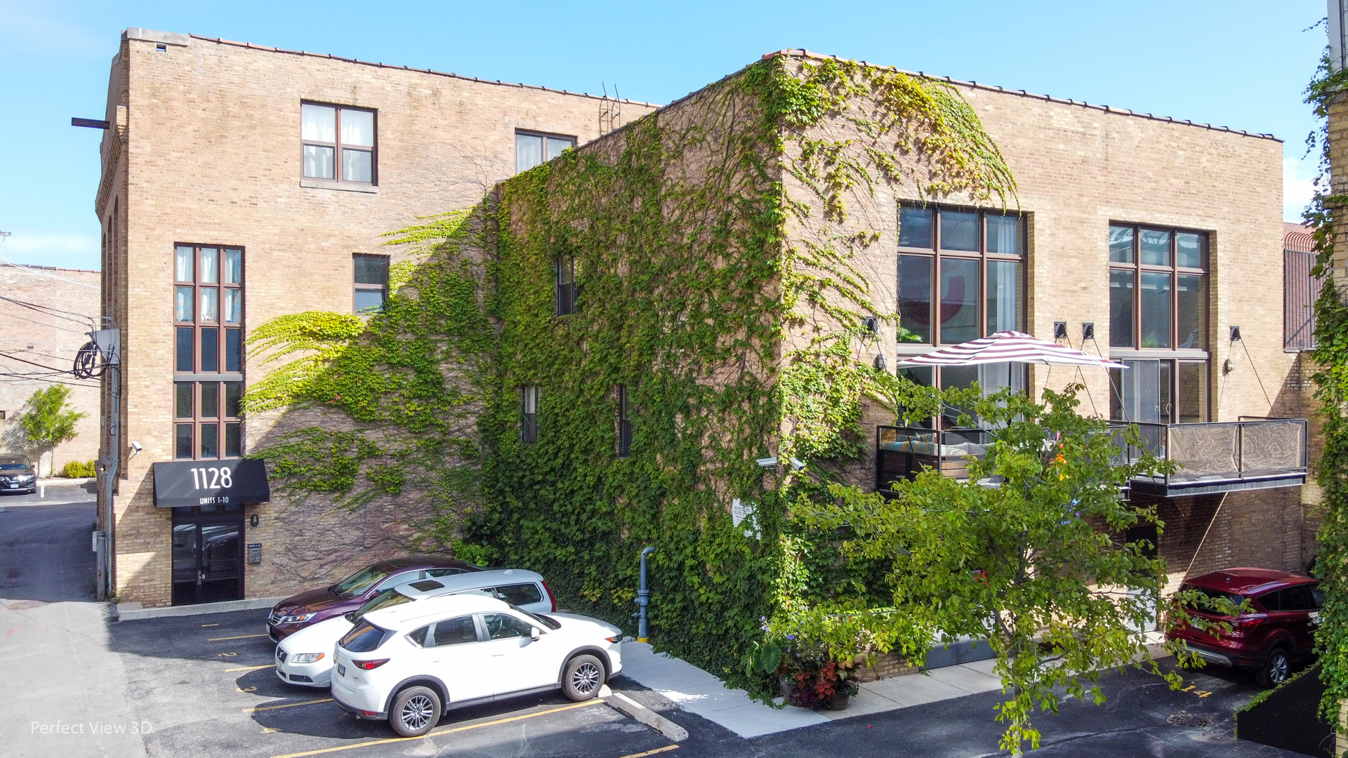 1128 West Ardmore Avenue, Unit 1 Chicago, IL 60660 - Photo 1 of 31 a front view of a house with a yard