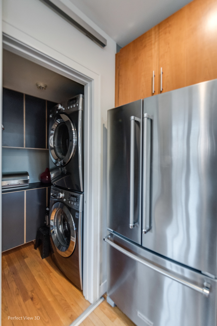1128 West Ardmore Avenue, Unit 1 Chicago, IL 60660 - Photo 14 of 31 a view of a storage & utility room with washer and dryer