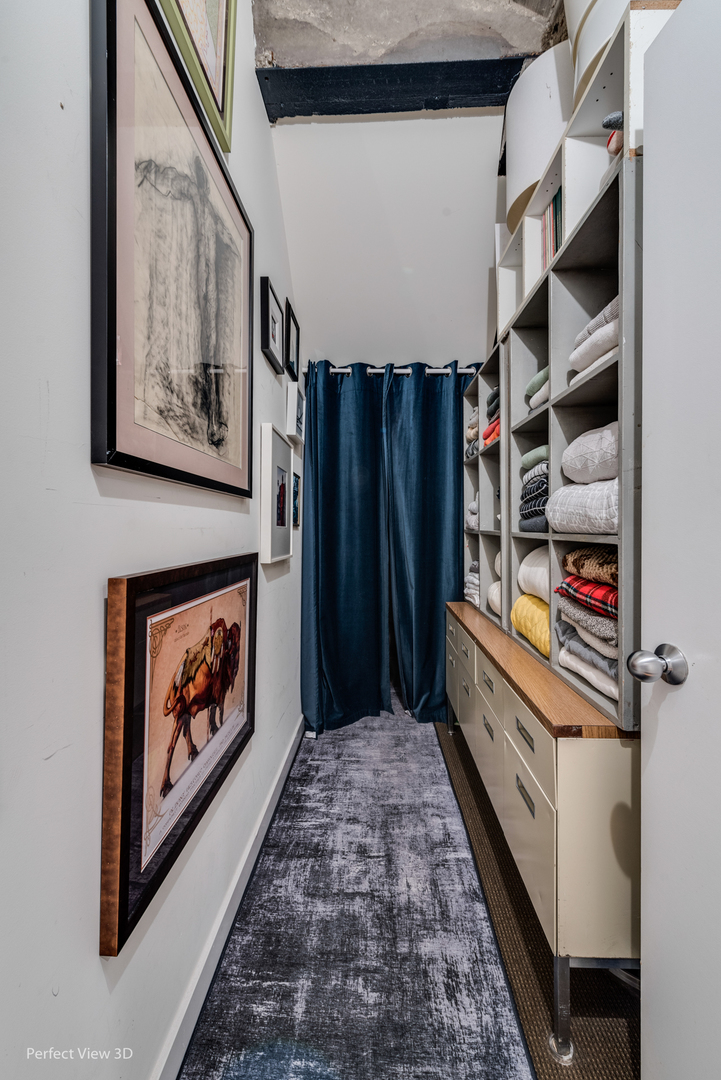 1128 West Ardmore Avenue, Unit 1 Chicago, IL 60660 - Photo 23 of 31 a view of a hallway with wooden floor and closet