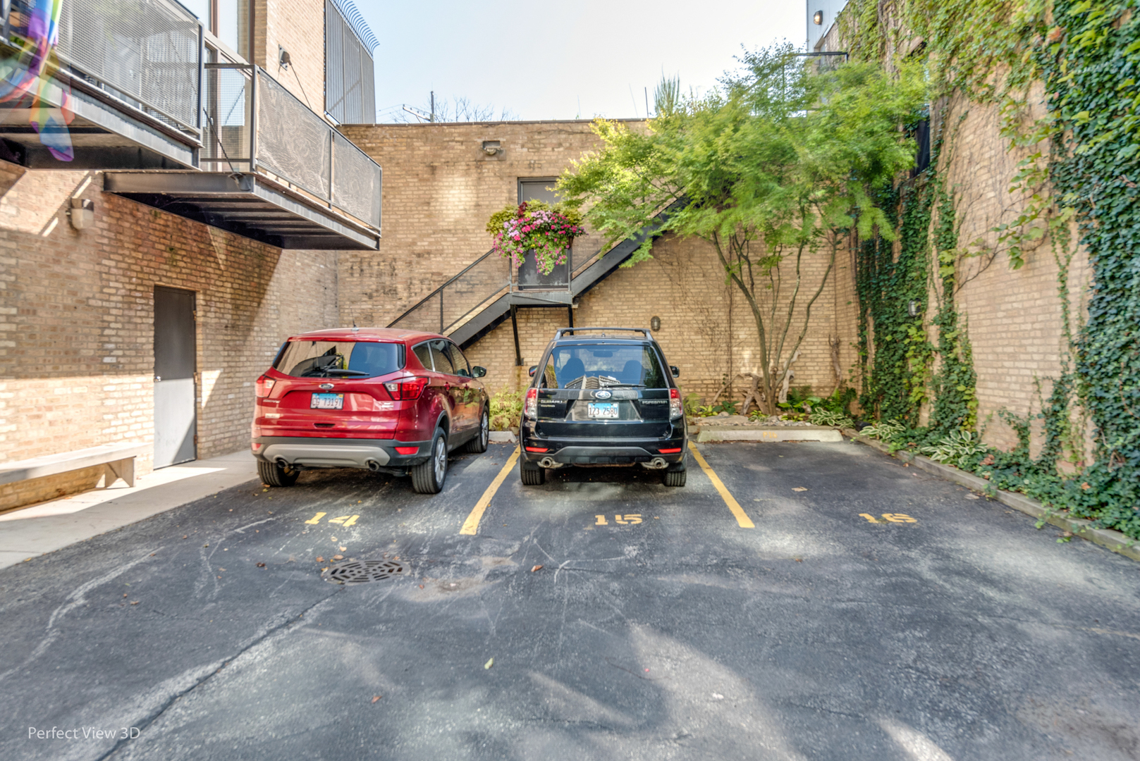 1128 West Ardmore Avenue, Unit 1 Chicago, IL 60660 - Photo 29 of 31 a view of a car in parking lot of house