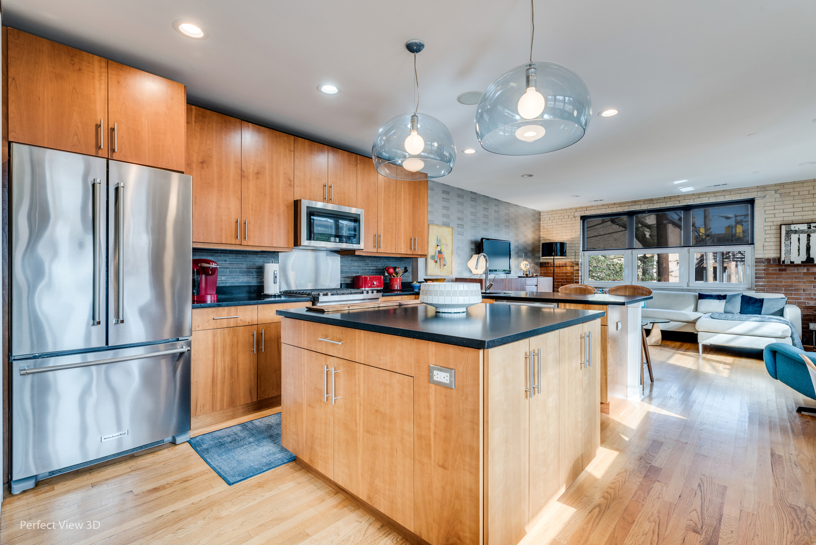 1128 West Ardmore Avenue, Unit 1 Chicago, IL 60660 - Photo 8 of 31 a kitchen with granite countertop stainless steel appliances and wooden cabinets