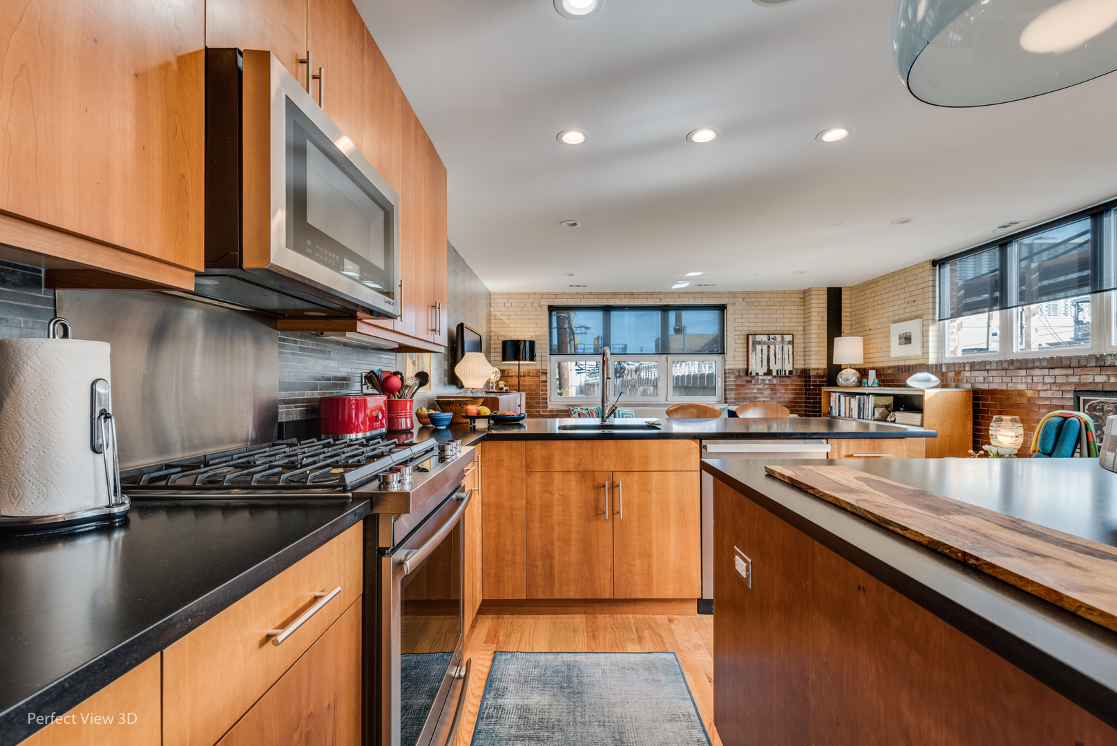 1128 West Ardmore Avenue, Unit 1 Chicago, IL 60660 - Photo 10 of 31 a kitchen with stainless steel appliances granite countertop a stove sink and cabinets