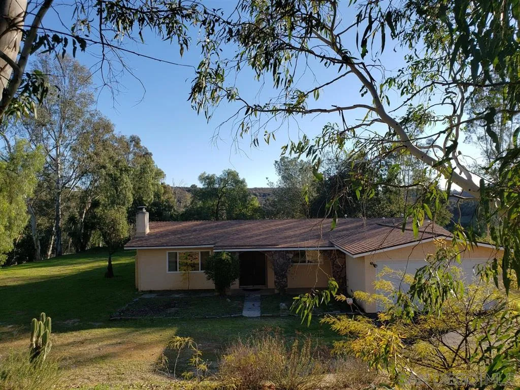 13425 Hilldale Road Valley Center, CA 92082 - Photo 1 of 13 a backyard of a house with yard and outdoor seating