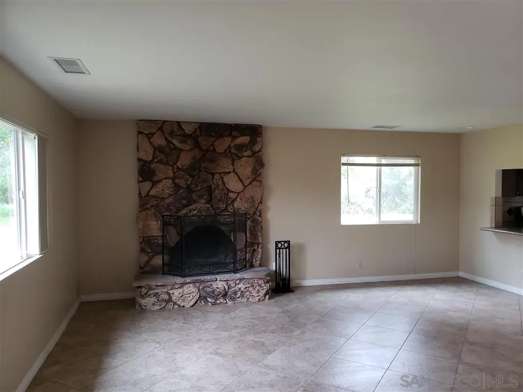 13425 Hilldale Road Valley Center, CA 92082 - Photo 5 of 13 an empty room with windows