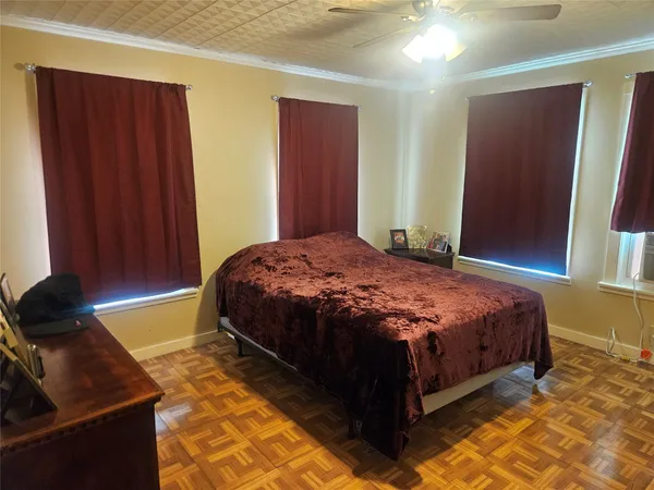 a bedroom with a bed and cabinets