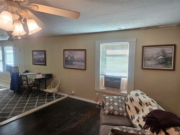 a bedroom with furniture and a window