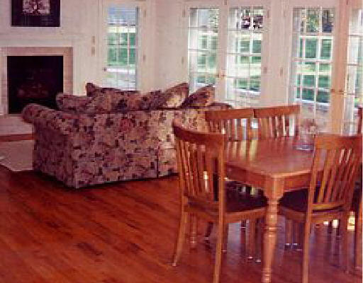 554 Ipswich Road Boxford, MA 01921 - Photo 4 of 6 a living room with furniture a fireplace and windows