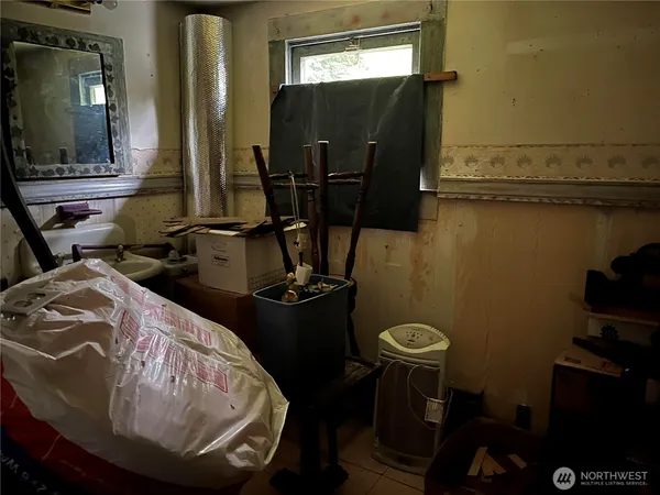 a bathroom with a sink and mirror