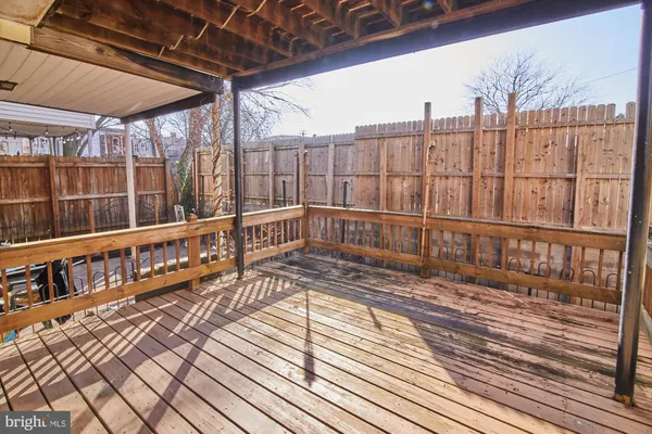 a view of a balcony with wooden floor