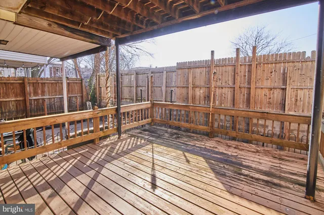 a view of a balcony with wooden floor