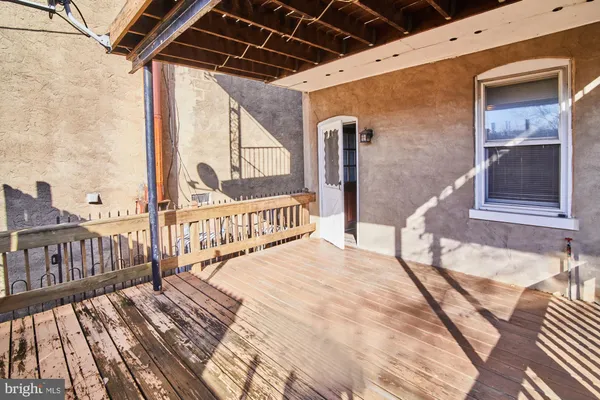 a view of a balcony with wooden floor