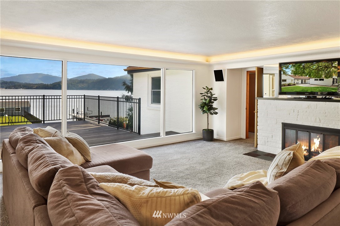 2301 North Shore Road Bellingham, WA 98226 - Photo 11 of 40 a living room with furniture and a fireplace