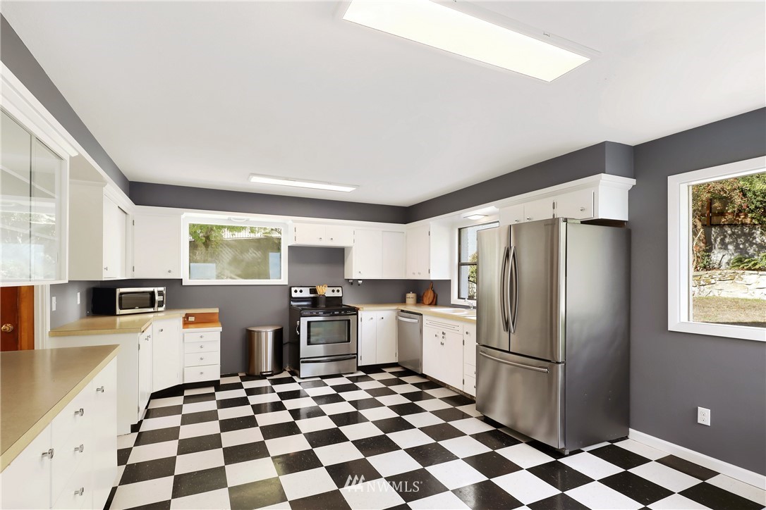 2301 North Shore Road Bellingham, WA 98226 - Photo 14 of 40 a kitchen with stainless steel appliances a refrigerator sink and stove top oven