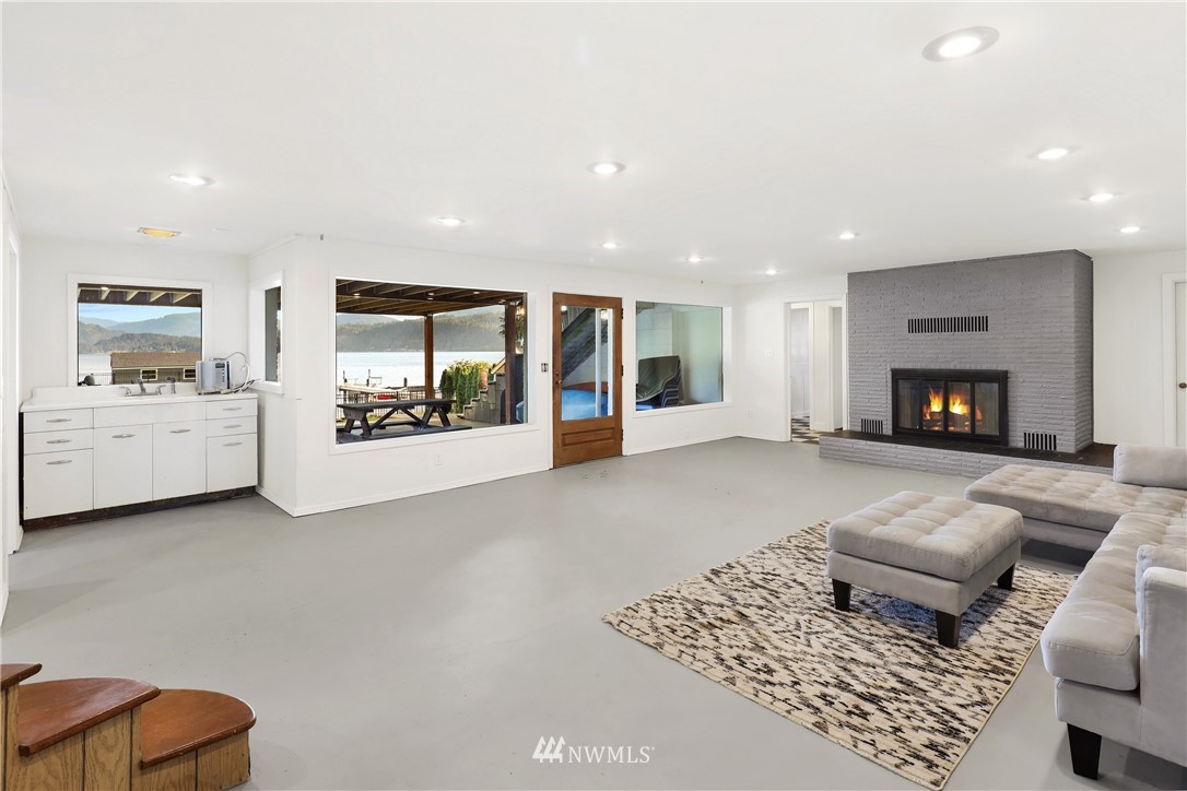 2301 North Shore Road Bellingham, WA 98226 - Photo 21 of 40 a living room with furniture and a fireplace