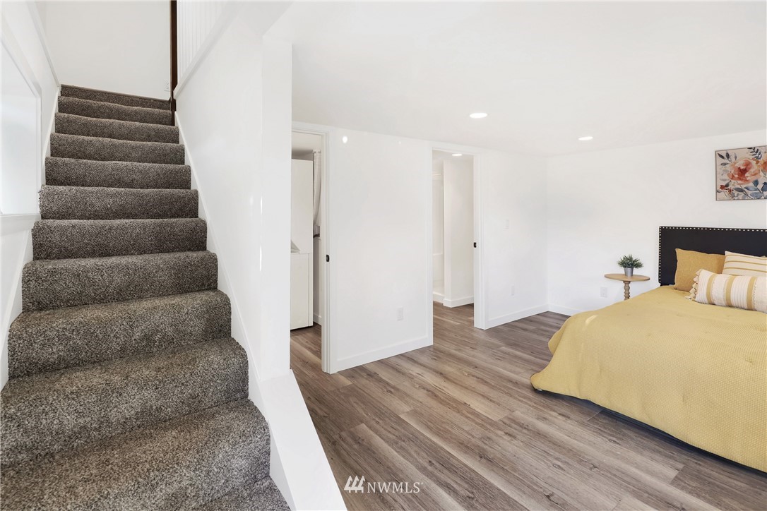 2301 North Shore Road Bellingham, WA 98226 - Photo 28 of 40 a bedroom with a bed and a ceiling fan