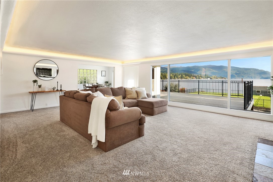 2301 North Shore Road Bellingham, WA 98226 - Photo 9 of 40 a living room with furniture and a floor to ceiling window