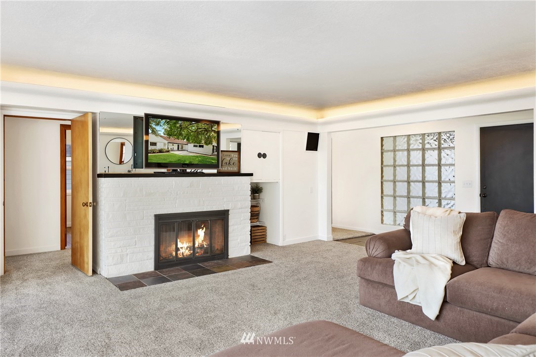 2301 North Shore Road Bellingham, WA 98226 - Photo 10 of 40 a living room with furniture and a fireplace