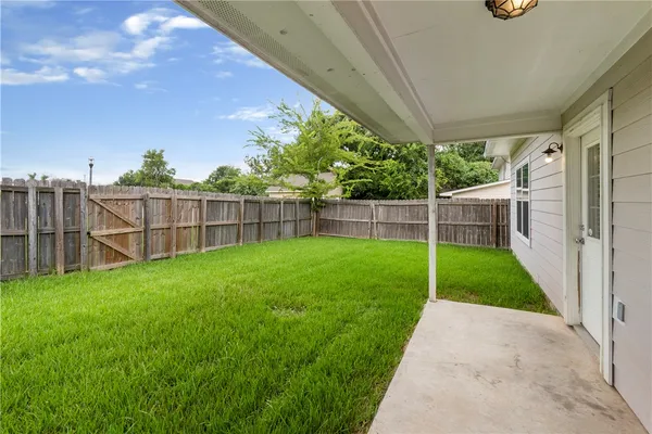 a view of a backyard with a garden