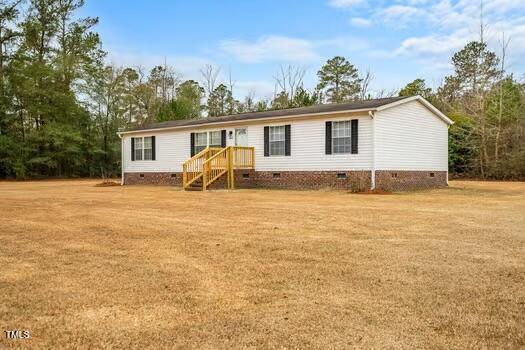 4210 Scronce Road Harrells, NC 28444 - Photo 1 of 28 a view of a house with yard and sitting area