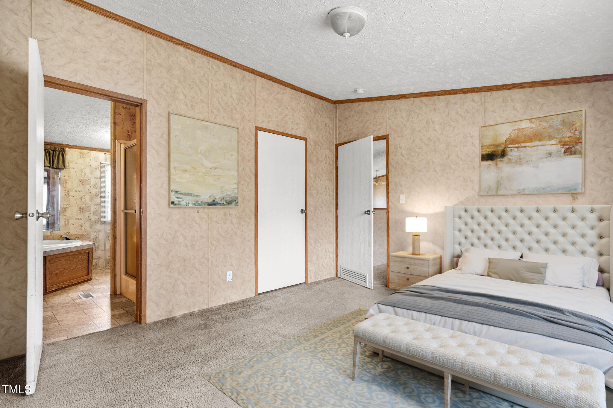 4210 Scronce Road Harrells, NC 28444 - Photo 11 of 28 a spacious bedroom with a bed and a walk in closet